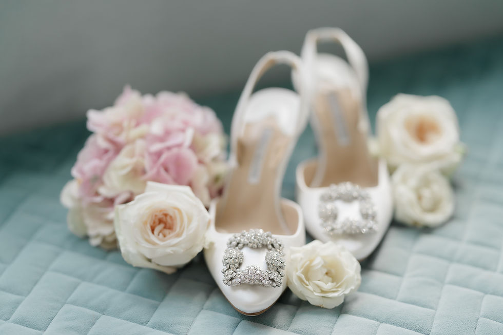 Elegant bridal shoes and bouquet by a London wedding photographer.