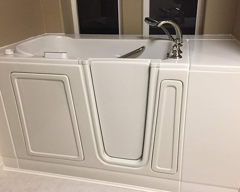 A white walk-in bathtub with a view.