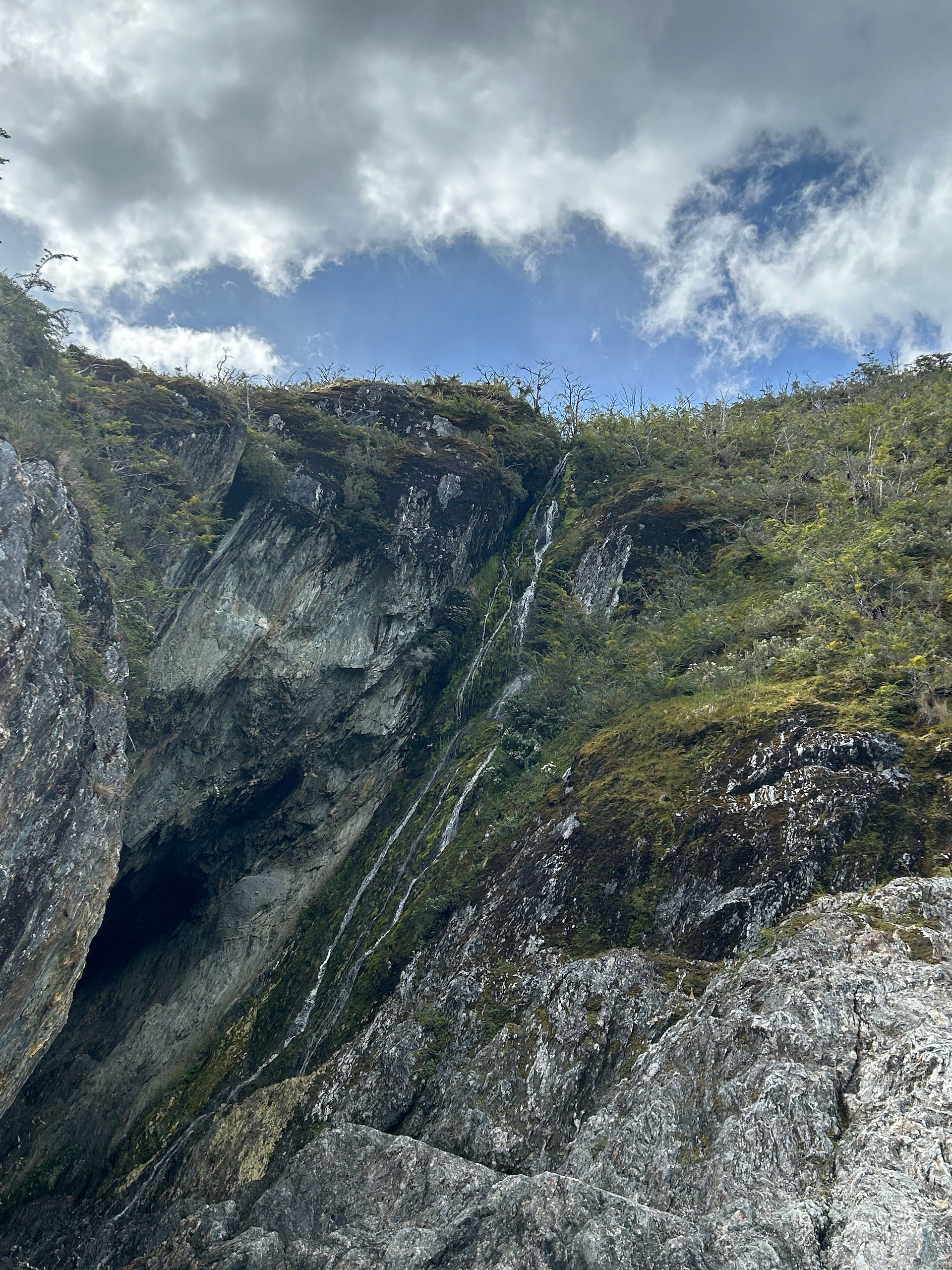 Waterfall along the steep fjord