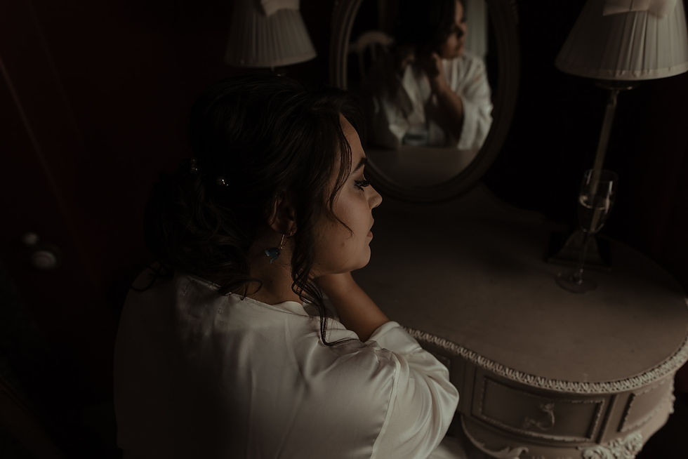bride putting on jewellery