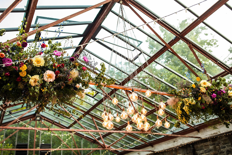 hanging installation of bright coloured flowers