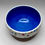 Thumbnail: Small porcelain bowl with cobalt blue interior and rainbow polka dots exterior.