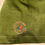 Thumbnail: green t-shirt with company logo print on sleeve