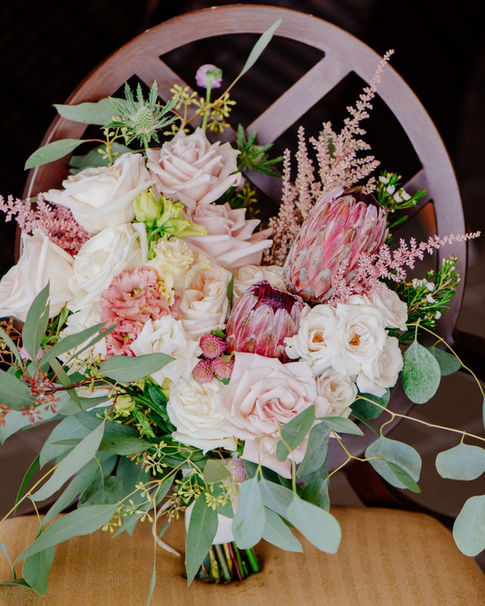 wedding, flowers, bouquet, greenery, foliage, bridal bouquet, roses, playa rose, playa, sweet escimo roses, astilbe, eryngium, thistle, protea, queen protea, eucalyptus, seeded eucalyptus, lisianthus, tropical, tropicals, exotic flowers, exotic