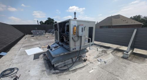Rooftop HVAC unit that is open and being evaluated for system performance