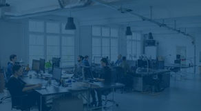 Picture of an office space with multiple employees working and everything seems to be fine - not to hot or too cold. there is a blue overlay on the picture.