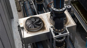 Industrial HVAC unit that appears to be off because the fans are not turning