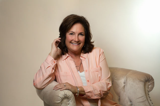 A personal branding photography session in Champaign, IL, featuring a confident entrepreneur in a stylish office setting.