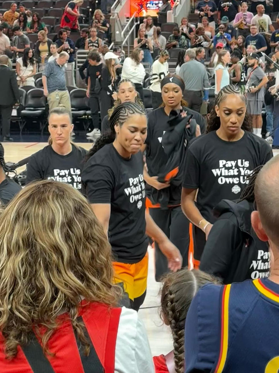 Players from both teams arrived on court pre-game wearing 'Pay us what you owe us' t-shirts.