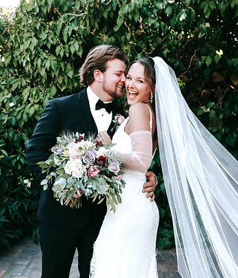 Bride and groom with overgrown greenery backgroud at The Grove in Las Vegas