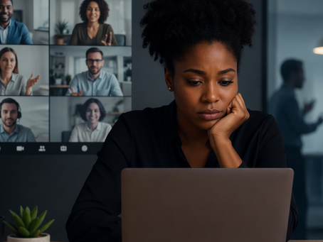 black woman working remotely on laptop appearing isolated while others collaborate virtually, representing challenges of documenting discrimination in remote work environments