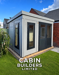 Dunster House Dominator Classic garden office with grey exterior panels and tall dark-framed windows.
