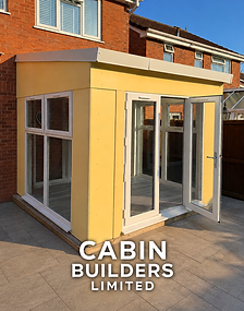 Dunster House Addroom conservatory beside a brick home, with cream exterior panels and white-framed glazed doors.