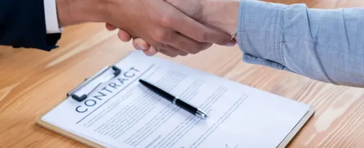 depositphotos_663291694-stock-photo-two-business-people-shake-hand.jpg