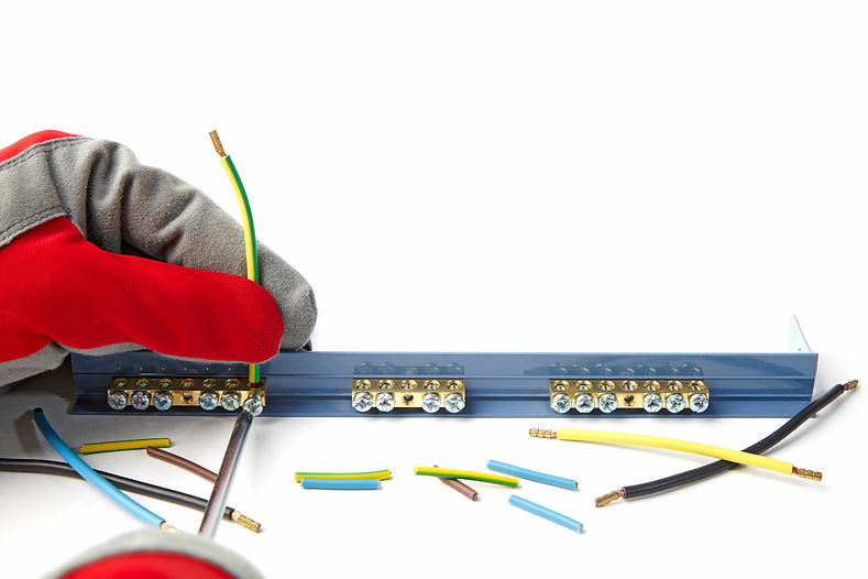 Installation electrical wire with terminal block. Electrician in protective gloves fixes e