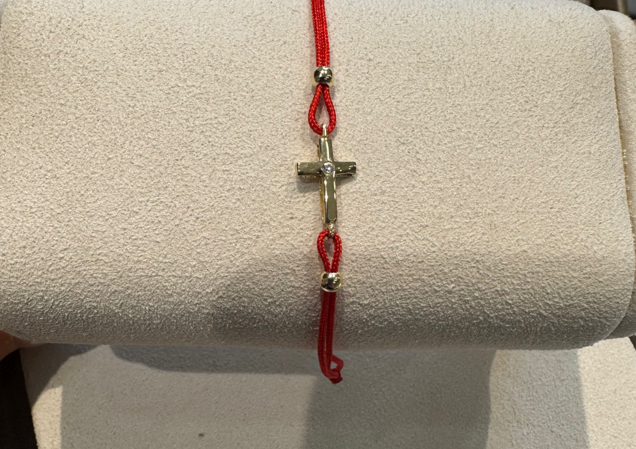 A thread for happiness with a golden pendant