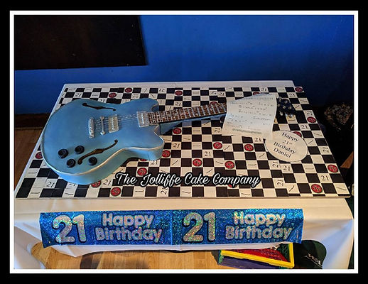 Life Like, actual sized, replica in cake of a denim blue mid tone Gibson Guitar