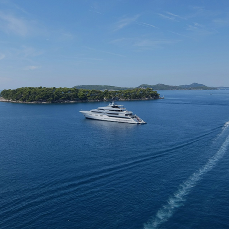 Bayan Yacht superyacht anchored by a private island
