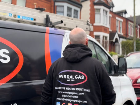 Engineer walking to Wirral Gas van