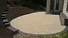 Decorative retaining wall project in Rostraver, PA with integrated patio space by Skowronek Landscaping & Excavating.