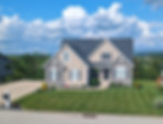 Residential landscape maintenance with trimmed shrubs and green lawn in Greensburg, PA.