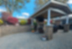 Hardscape patio with outdoor pavilion and fireplace in Greensburg, PA built by Skowronek Landscaping & Excavating.
