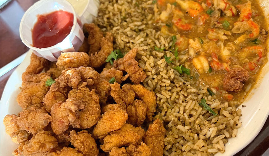 Crawfish Platter. Left to right: fried crawfish, dirty rice, and crawfish étouffée.