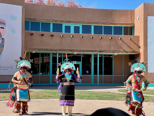 Cellicion Zuni Dancers performing the Star Dance with dancers wearing turquoise colored headpieces with stars on them.