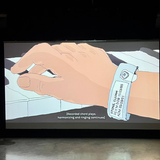 ELI is a short film by Nate Milton. Image features the hand of the main character, Eli, who is wearing a medical band from a hospital as he plays the piano.