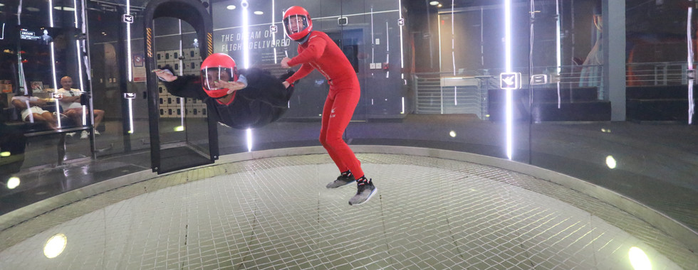 Kimi flying in the plexiglass tunnel with her instructor, Hank