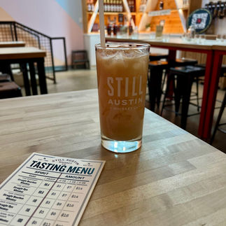 'Tis the Season Cocktail in the tasting room next to a small print out of the tasting menu.