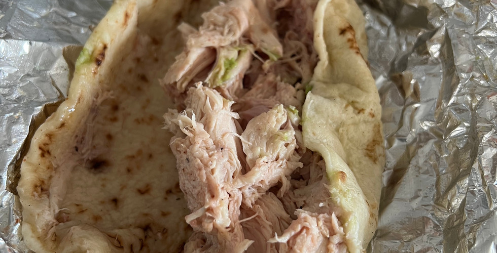 Valentina's Pulled Pollo Taco. Pulled barbeque chicken with guacamole wrapped in a fresh flour tortilla.