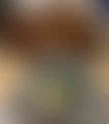 Barbecued Meats featuring a pan of barbecued turkey, ribs, and sausage links. A bowl of kale salad is placed below the pan of meats.