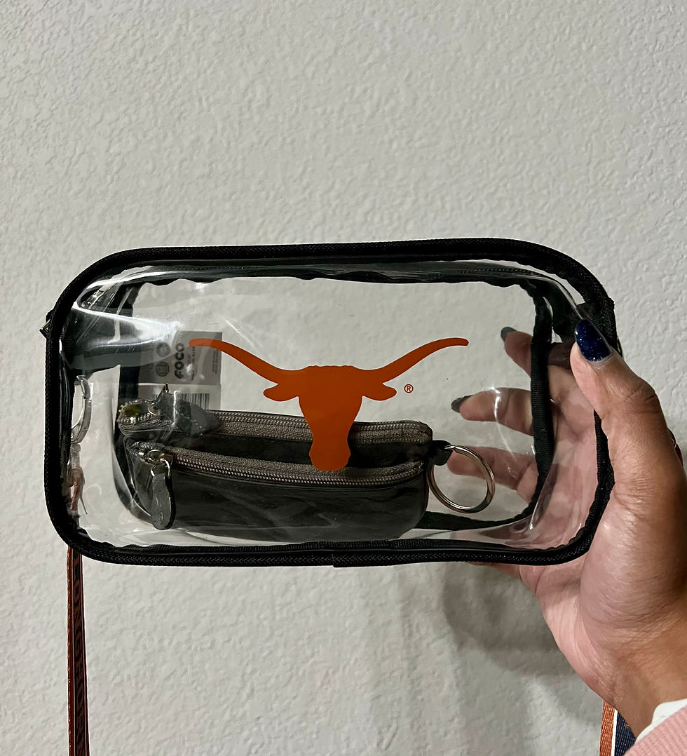Rounded horizontal clear crossbody bag with black piping along the edges and a burnt orange Longhorn emblem on the center of the clear bag.