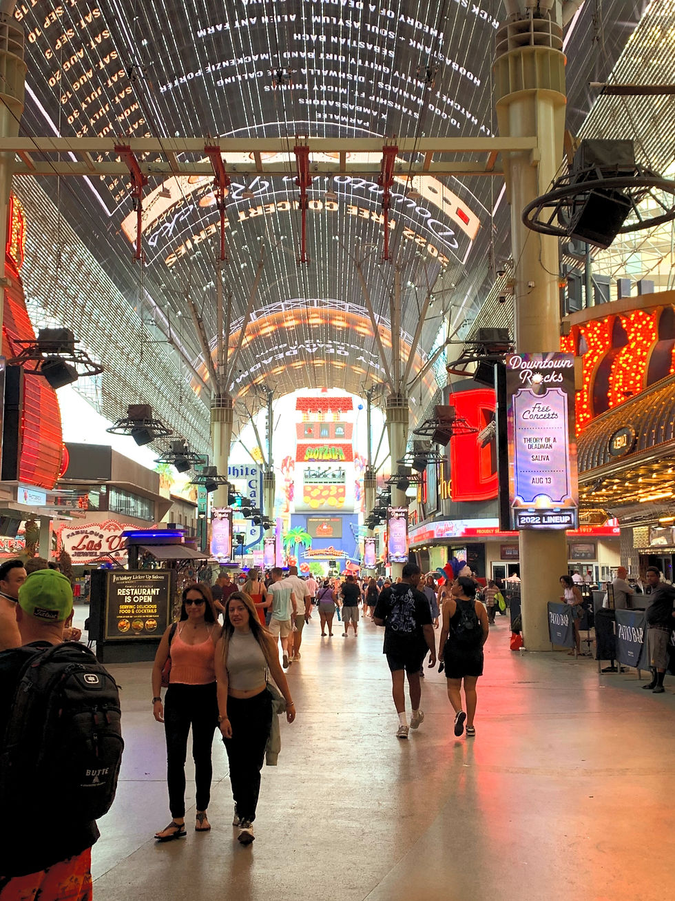 Fremont Street Experience in the daytime facing the Slotzilla zip line tower. There is lots of open space under all the lights as there are about 75% fewer people than there would be at night.