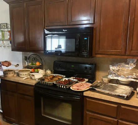 Thanksgiving 2019 BBQ featuring sausage, hens, ham, and some side dishes.