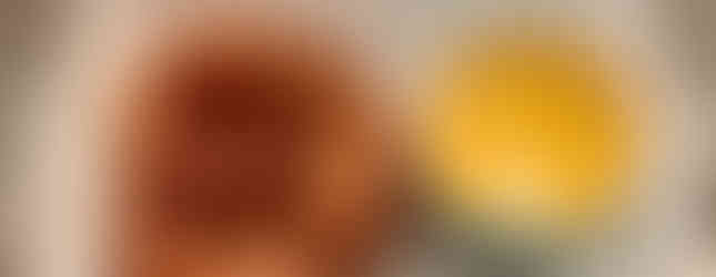 Soft pretzel on the left and green chili cheese sauce on the right