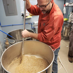 Man mixing beer ingredients