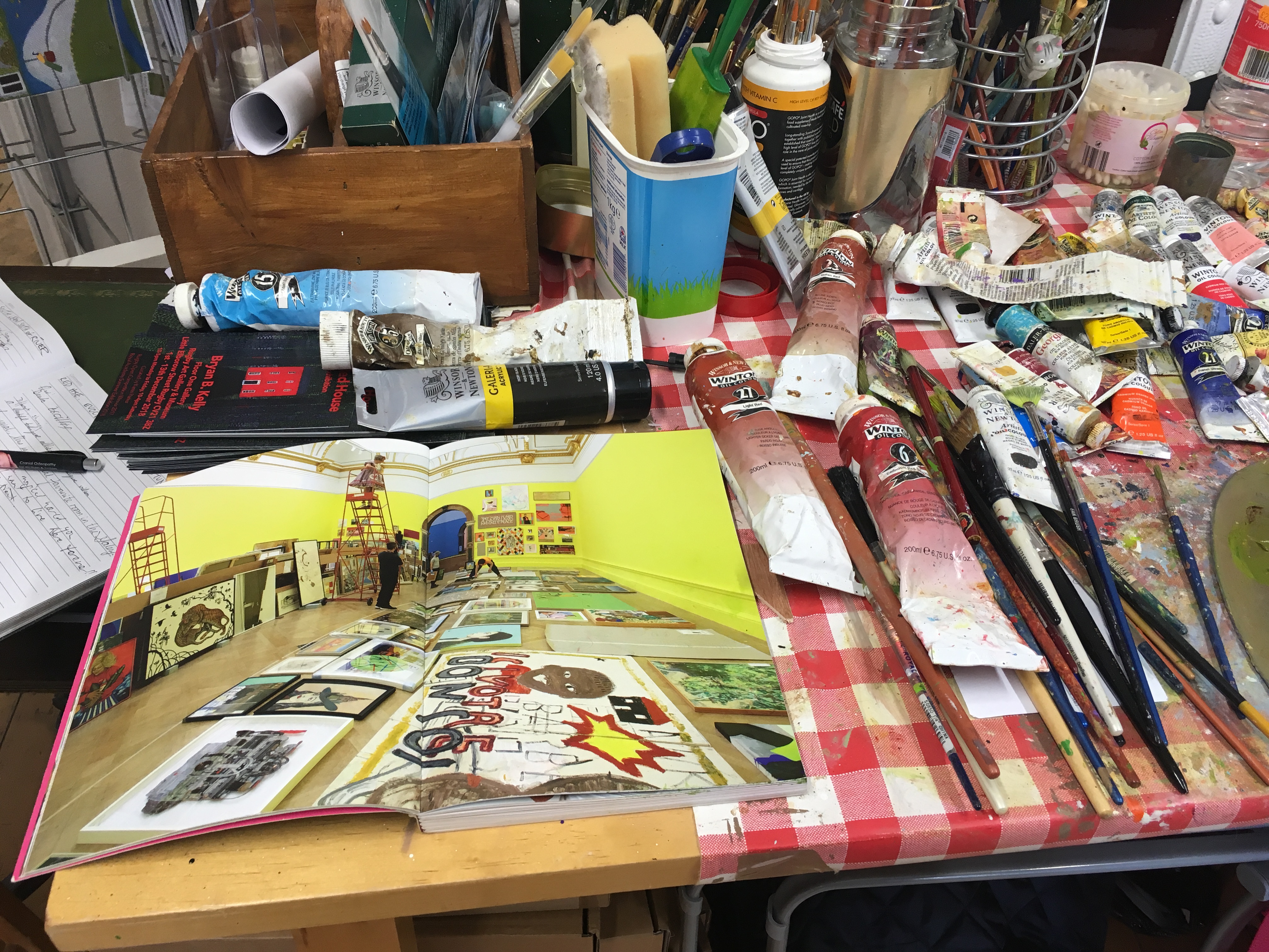 RA catalogue open in studio