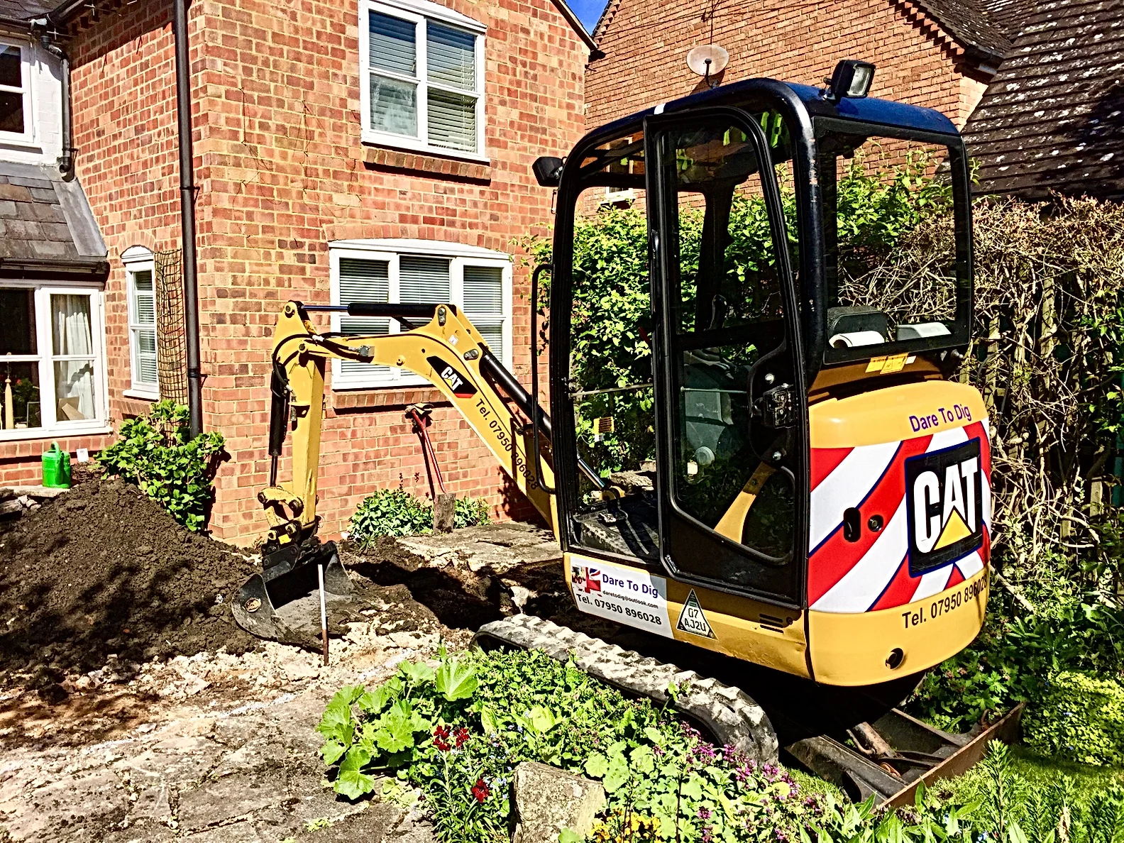 CAT machine digging a hole on the ground