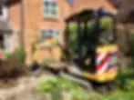 CAT machine digging a hole on the ground