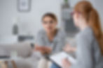woman speaking to a therapist about anxiety