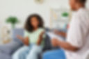teenage BAME girl with specialist for assessment