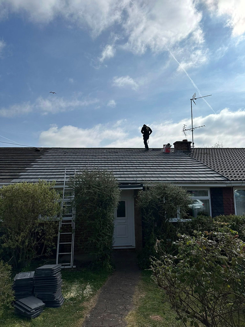 New roof installation with a new Velux installed brand new tiles and a dry ridge system