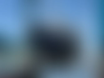 2000 Cabo Rico NE 400 with a flag blue hull in a travel lift preparing for a survey and sold by Ward Yacht Sales