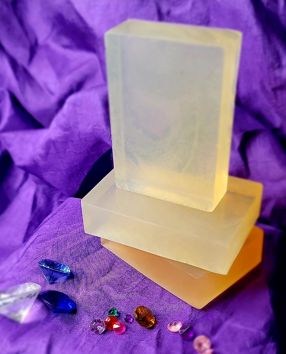 Thumbnail: Three clear soap bars sit on a purple cloth 