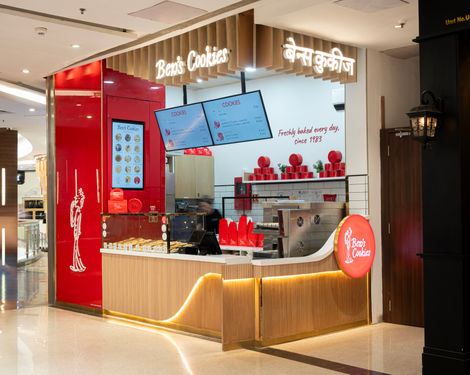 Cookie shop with red and wooden interior design.