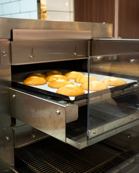 Buns baking in a commercial oven.