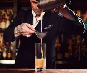 Photo of Dan Strahand at Doss House creating a cocktail