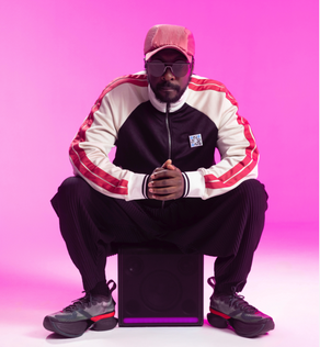 Photo of Will.I.Am sitting on LG xboom Stage 301 